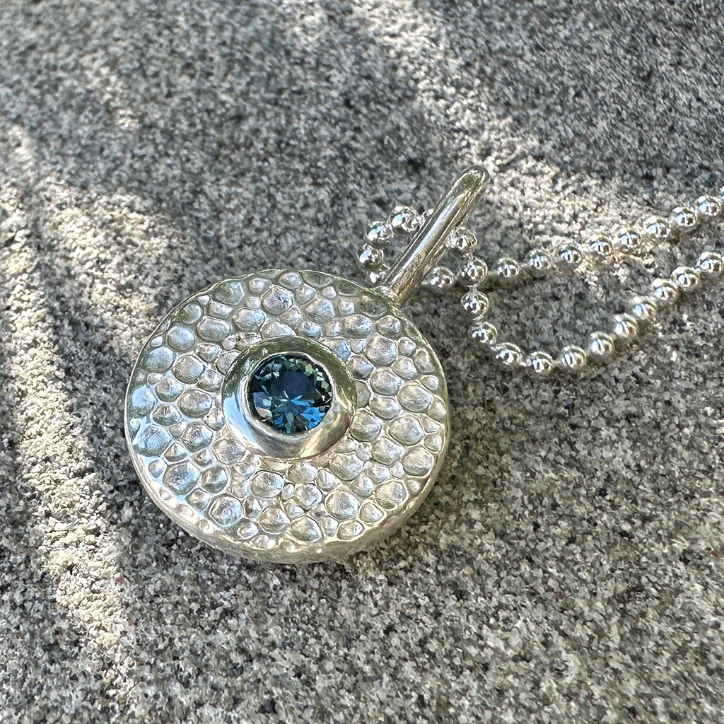 Fine silver pendant with Australian sapphire with manta ray texture inspired by the ocean